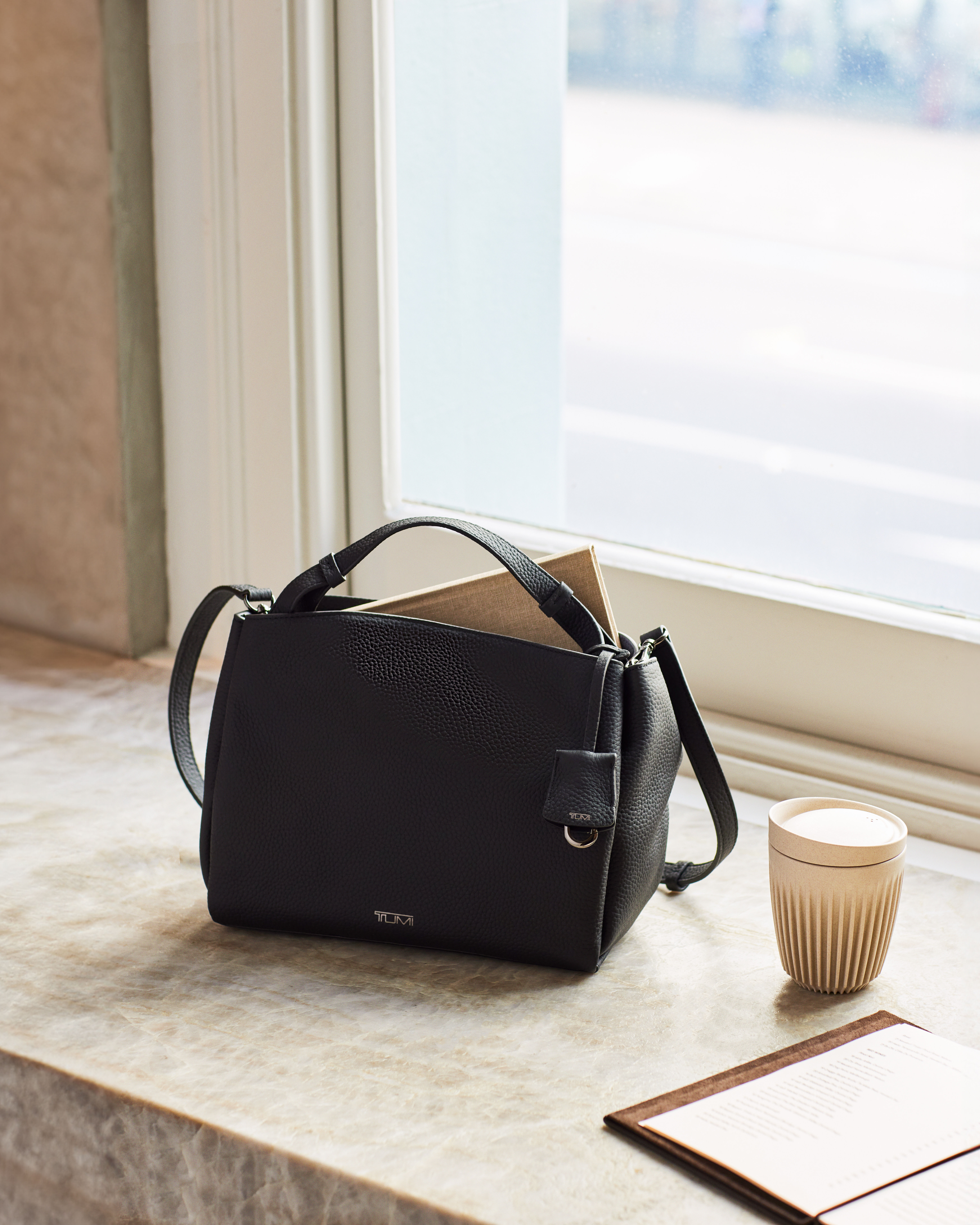 Tumi crossbody top bag leather